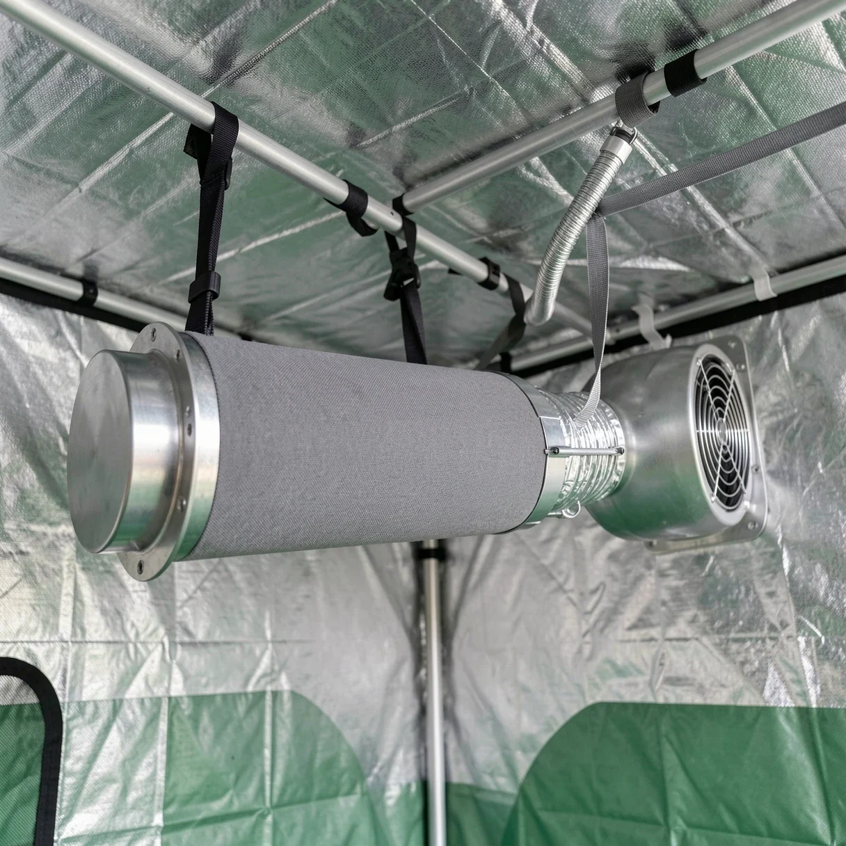 Inline exhaust fan and carbon filter mounted at the top of a cannabis grow tent
